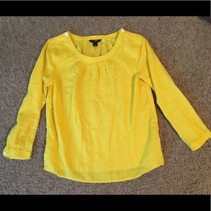 Yellow blouse with white button details